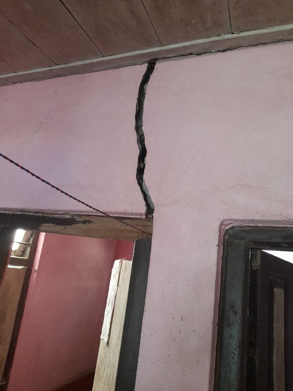 Wide crack running from door lintel to ceiling · Sikkim
