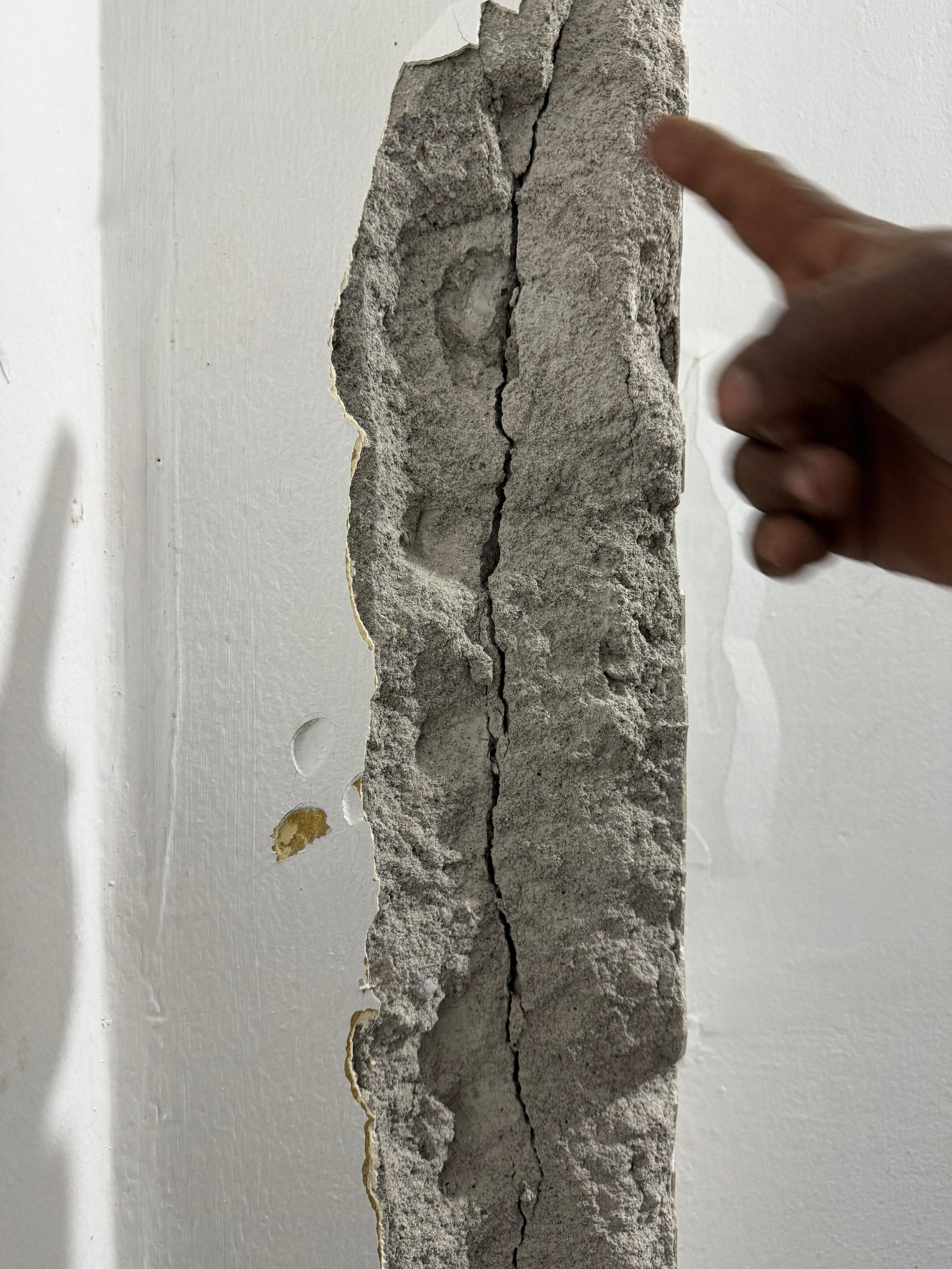 Vertical crack in column after plaster removal · Sikkim